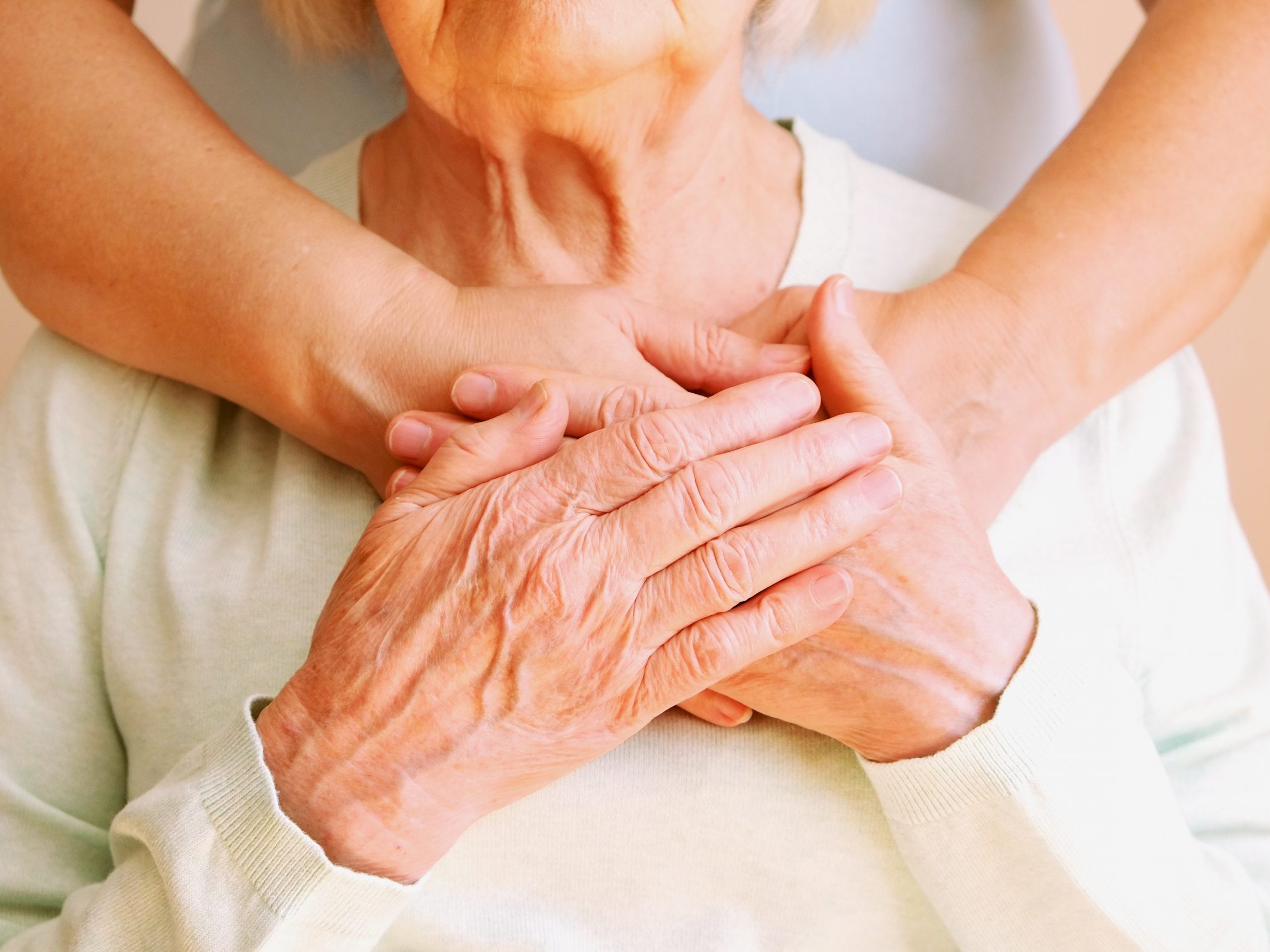 caregiver_holding_hands_with_patient