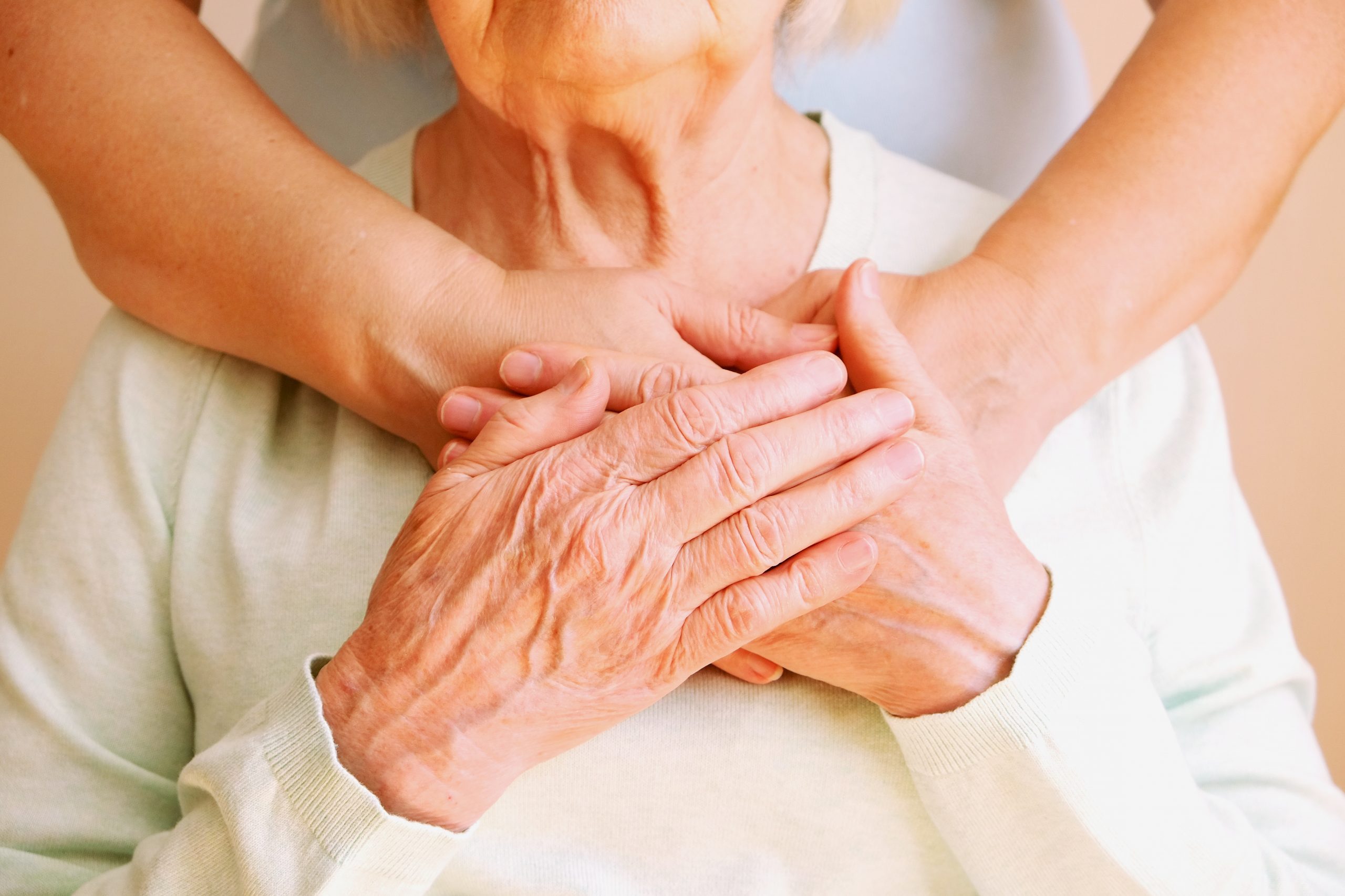 caregiver_holding_hands_with_patient